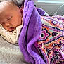 Lily is registered to the contest to win money with this photo: baby, infant, sleeping, blanket, purple_blanket, patterned_blanket, cozy, bed, pillow, face, head, closed_eyes, swaddle, onesie, arm, skin, newborn, nap, window, fabric
