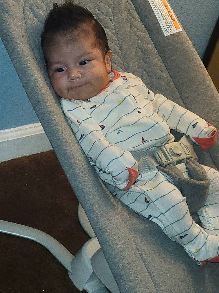 Cristian is registered to the contest to win money with this photo: arm, baby, baby_carriage, baby_toddler_clothing, cheek, comfort, cool, eye, face, finger, head, human_body, joint, leg, nose, person, skin, smile, tints_and_shades, toddler