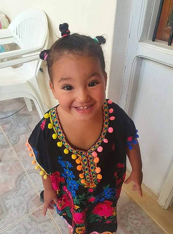 Meryem participe au concours pour gagner de l'argent avec cette photo : baby_toddler_clothing, chair, clothing, door, dress, eyebrow, flooring, fun, happy, iris, jewellery, joy, lip, neck, nose, pattern, person, skin, sleeve, smile