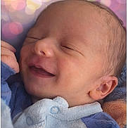 Eynoan participe au concours pour gagner de l'argent avec cette photo : newborn, baby, smiling, sleeping, blanket, soft, cozy, portrait, infant, cute, face, head, child, human, warm, comfort, blue_clothing, peaceful, closeup, bokeh_background