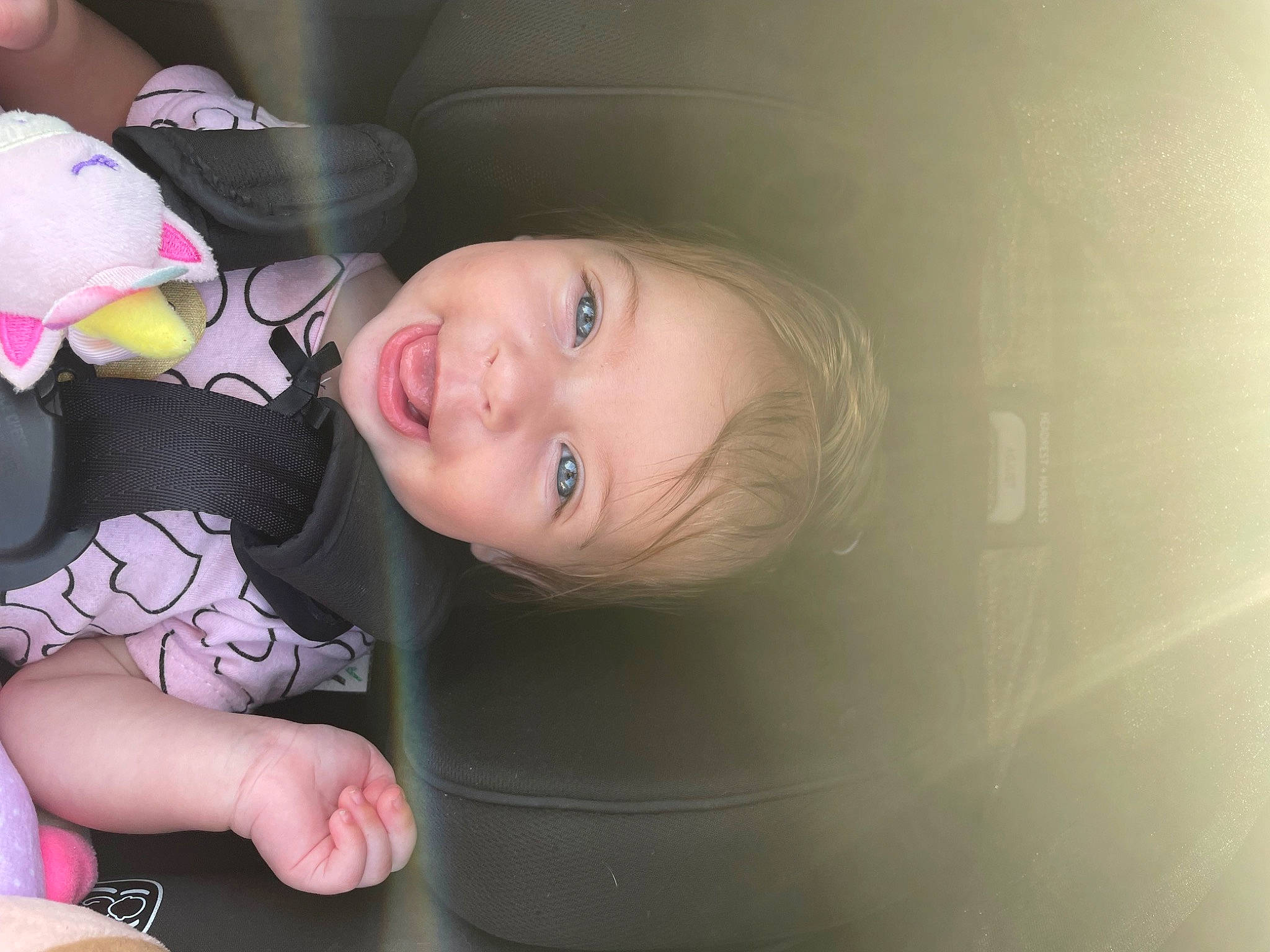 Avalynn is registered to the contest to win money with this photo: auto_part, baby, baby_laughing, baby_products, baby_toddler_clothing, car_seat, cheek, child, flash_photography, fun, happy, laugh, nail, person, play, portrait_photography, room, sitting, smile, toddler