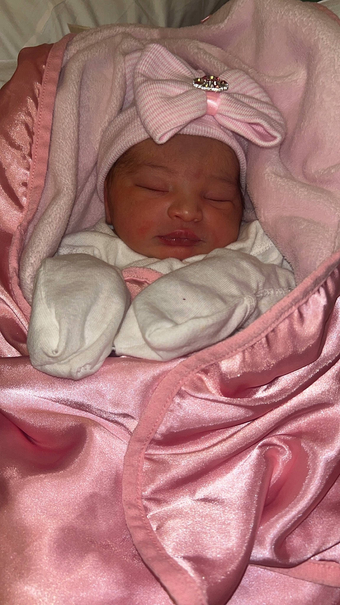 Celeste is registered to the contest to win money with this photo: baby, baby_products, baby_sleeping, baby_toddler_clothing, bedtime, carmine, cheek, child, comfort, flesh, headwear, linens, magenta, mouth, nap, peach, person, pink, skin, sleep