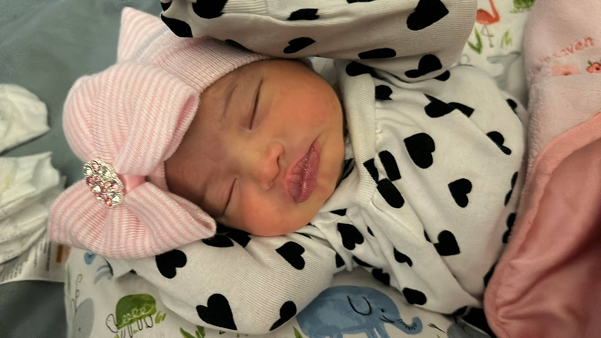 Celeste joined the competition — help win amazing prizes! baby, baby_products, baby_sleeping, baby_toddler_clothing, bedtime, cheek, child, comfort, eyelash, fashion_accessory, happy, headwear, linens, nap, pattern, person, pink, sleep, sleeve, textile