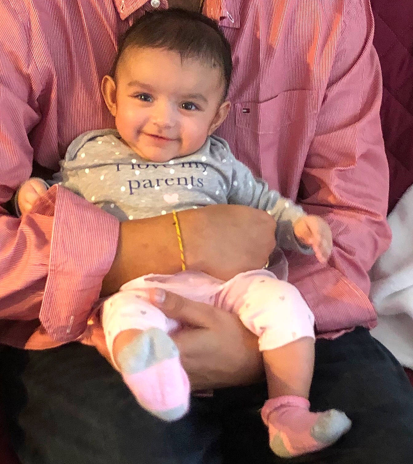 Shanaya is registered to the contest to win money with this photo: baby, cheek, child, finger, joy, person, pink, product, sitting, skin, smile, toddler