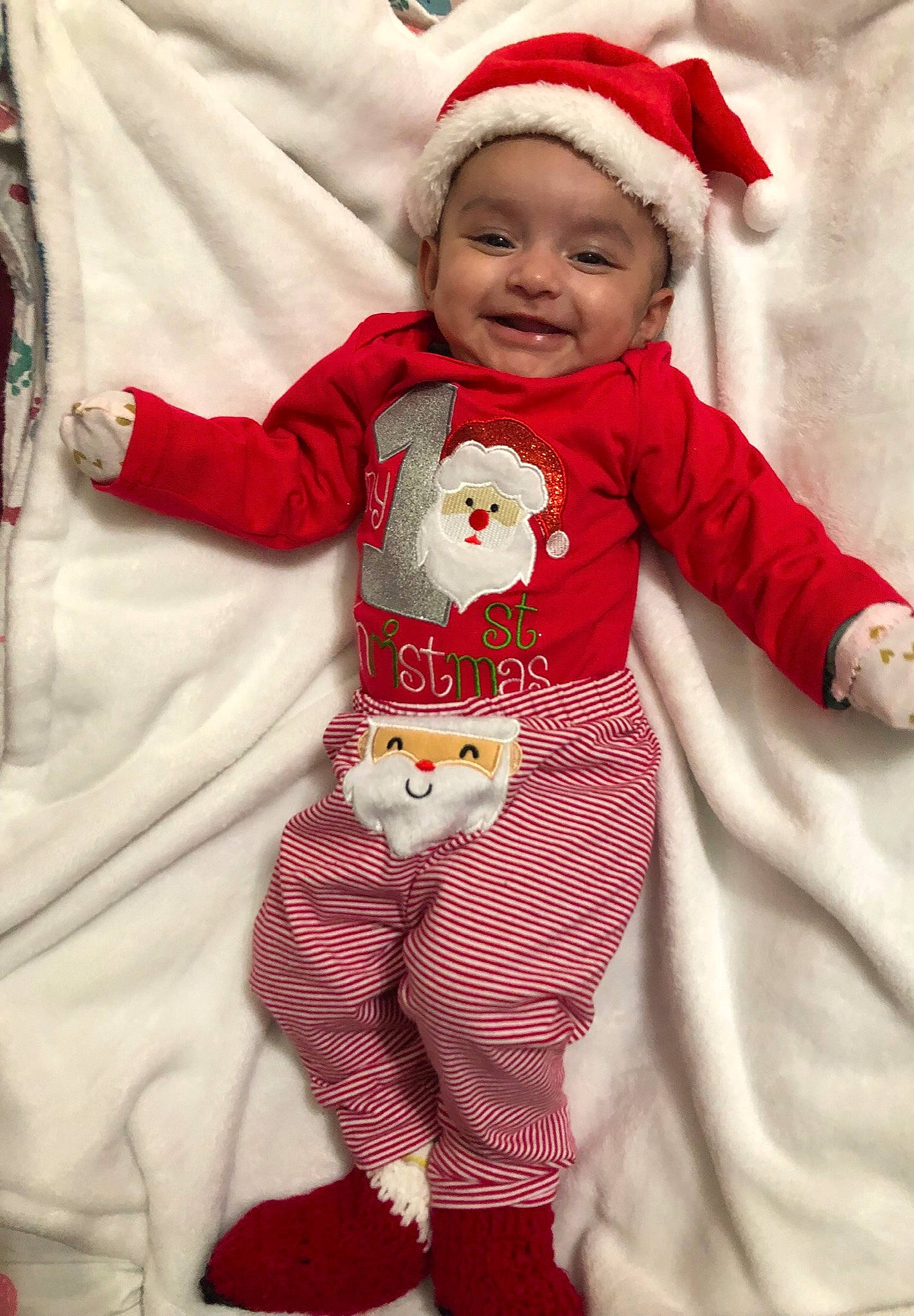 Shanaya is registered to the contest to win money with this photo: baby, baby_toddler_clothing, child, christmas, fictional_character, headwear, joy, pajamas, person, sleeve, toddler