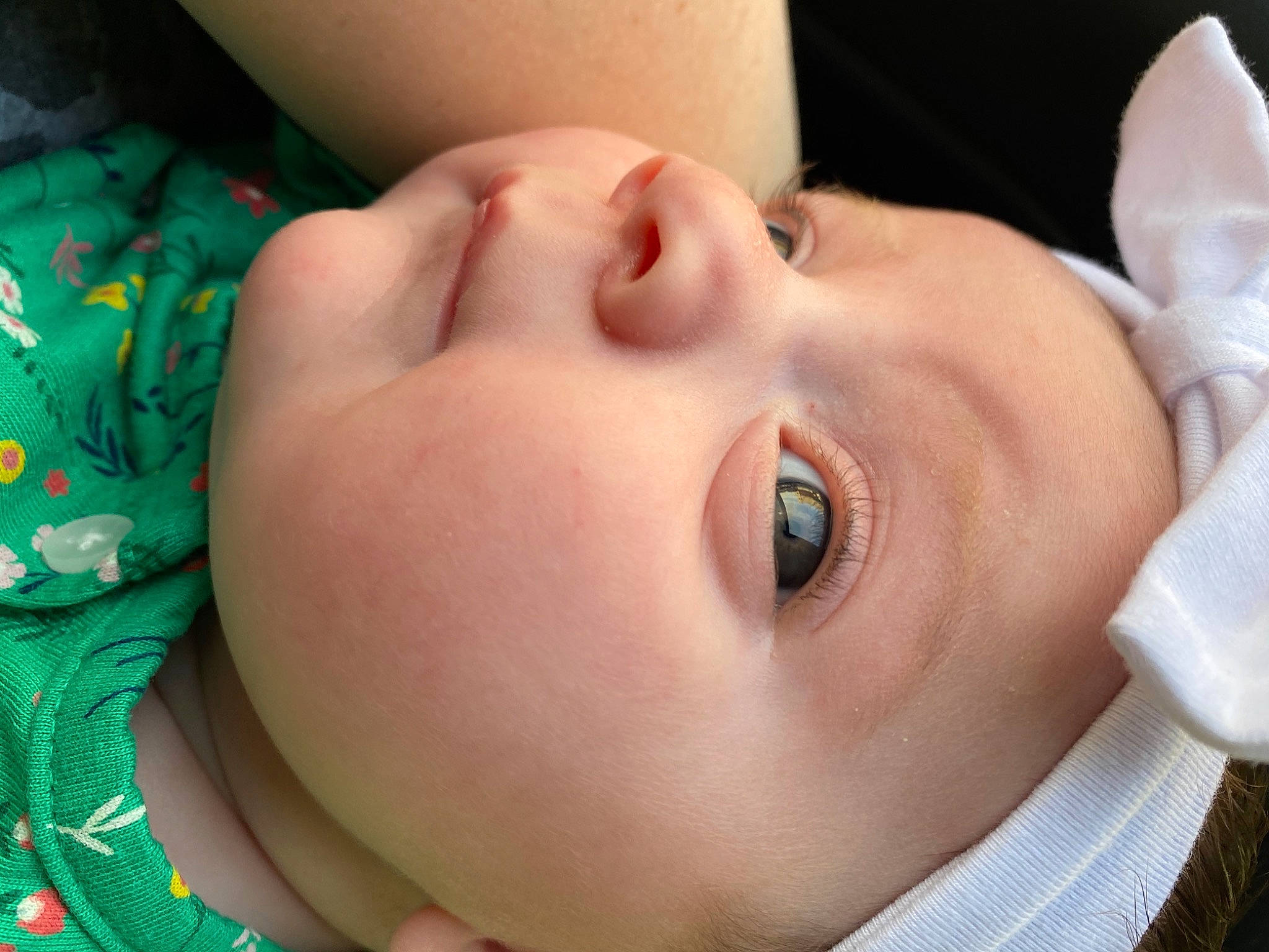 Adrianna is registered to the contest to win money with this photo: baby, baby_toddler_clothing, cheek, ear, eye, eyebrow, eyelash, face, green, happy, head, headgear, human_body, iris, lip, mouth, neck, nose, person, skin