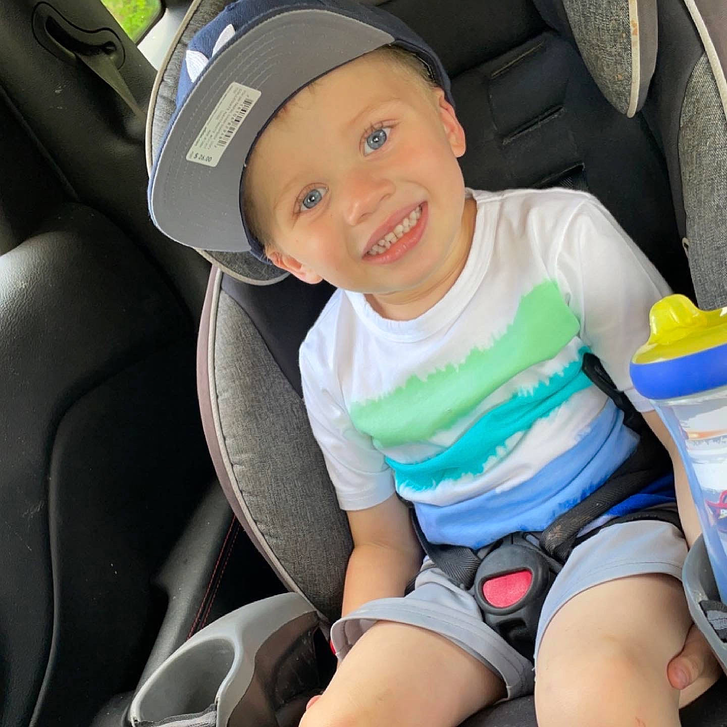 Conor is registered to the contest to win money with this photo: auto_part, automotive_design, car, car_seat, car_seat_cover, comfort, cool, facial_expression, fun, headwear, joy, light, motor_vehicle, person, product, seat_belt, smile, steering_part, steering_wheel, thigh