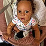 Londyn joined the competition — help win amazing prizes! baby, child, curly_hair, blue_eyes, baby_seat, blanket, clothing, indoors, cute, infant, person, sitting, looking_up, expression, soft_toys, fabric, colorful, cute_outfit, black_socks, hand