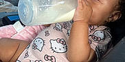 Londyn joined the competition — help win amazing prizes! toddler, baby, milk_bottle, car_seat, hello_kitty, clothing, blanket, infant, cute, milk, feeding, child, seat, pink, hand, face, skin, curly_hair, indoor, person