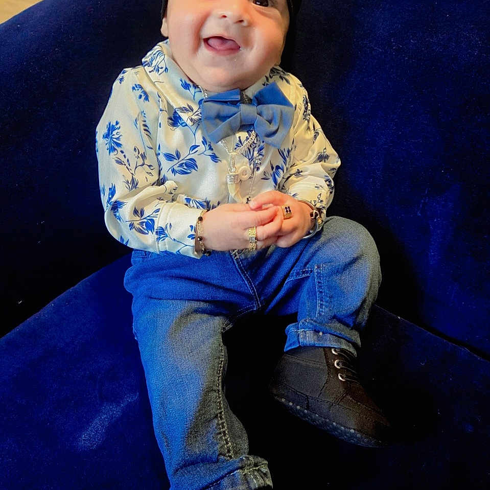 Yuvansh joined the competition — help win amazing prizes! baby, black_hat, black_shoes, blue_couch, bow_tie, bracelet, child, cozy, cute, cute_outfit, fashion, floral_shirt, happy, indoors, jeans, jewelry, portrait, ring, sitting, smiling