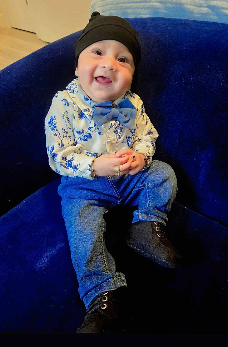 Yuvansh joined the competition — help win amazing prizes! baby, black_hat, black_shoes, blue_couch, bow_tie, bracelet, child, cozy, cute, cute_outfit, fashion, floral_shirt, happy, indoors, jeans, jewelry, portrait, ring, sitting, smiling