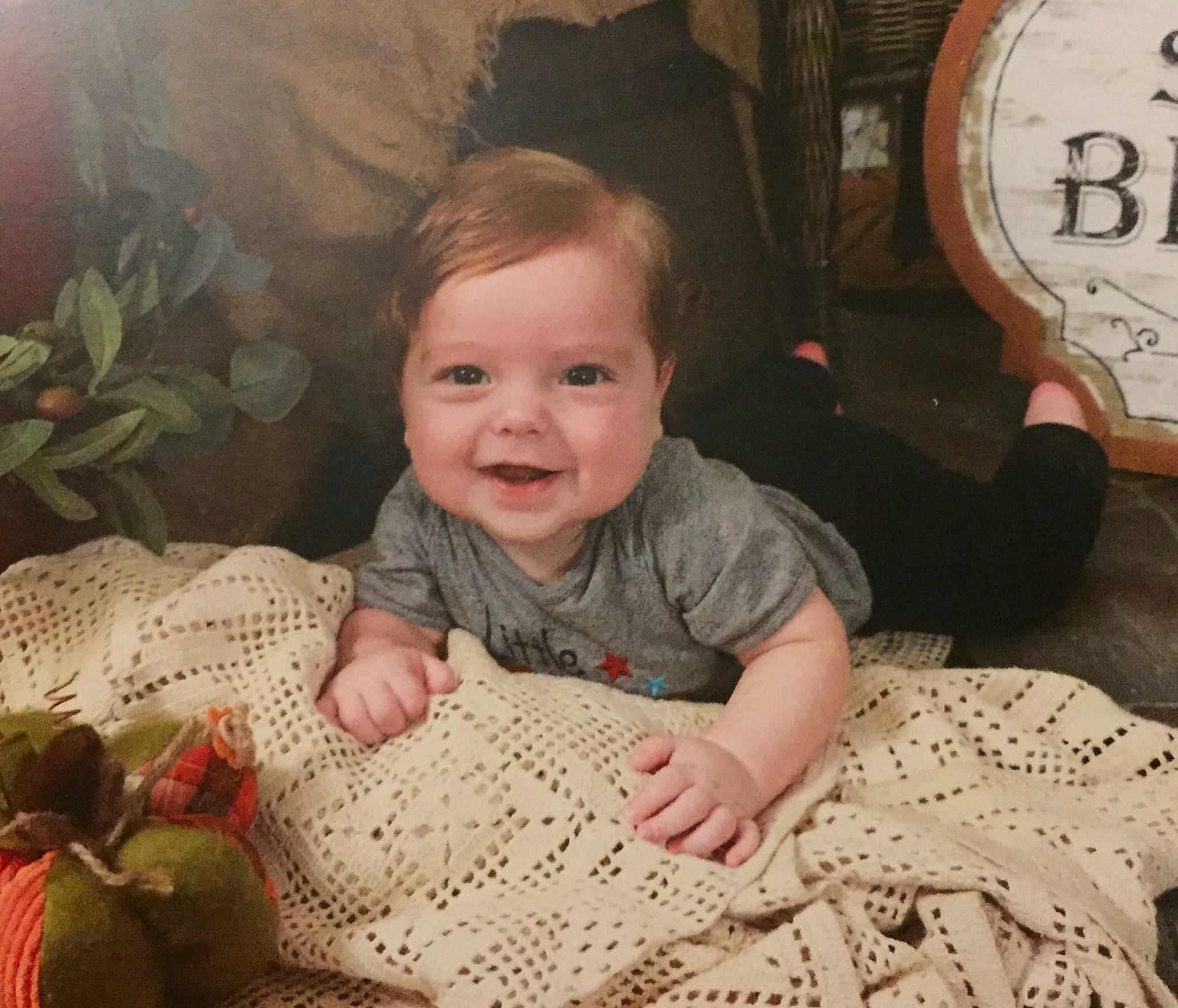 Oliver is registered to the contest to win money with this photo: baby, cheek, child, eye, face, facial_expression, family, happy, head, human, joy, people, person, play, sitting, skin, smile, textile, toddler