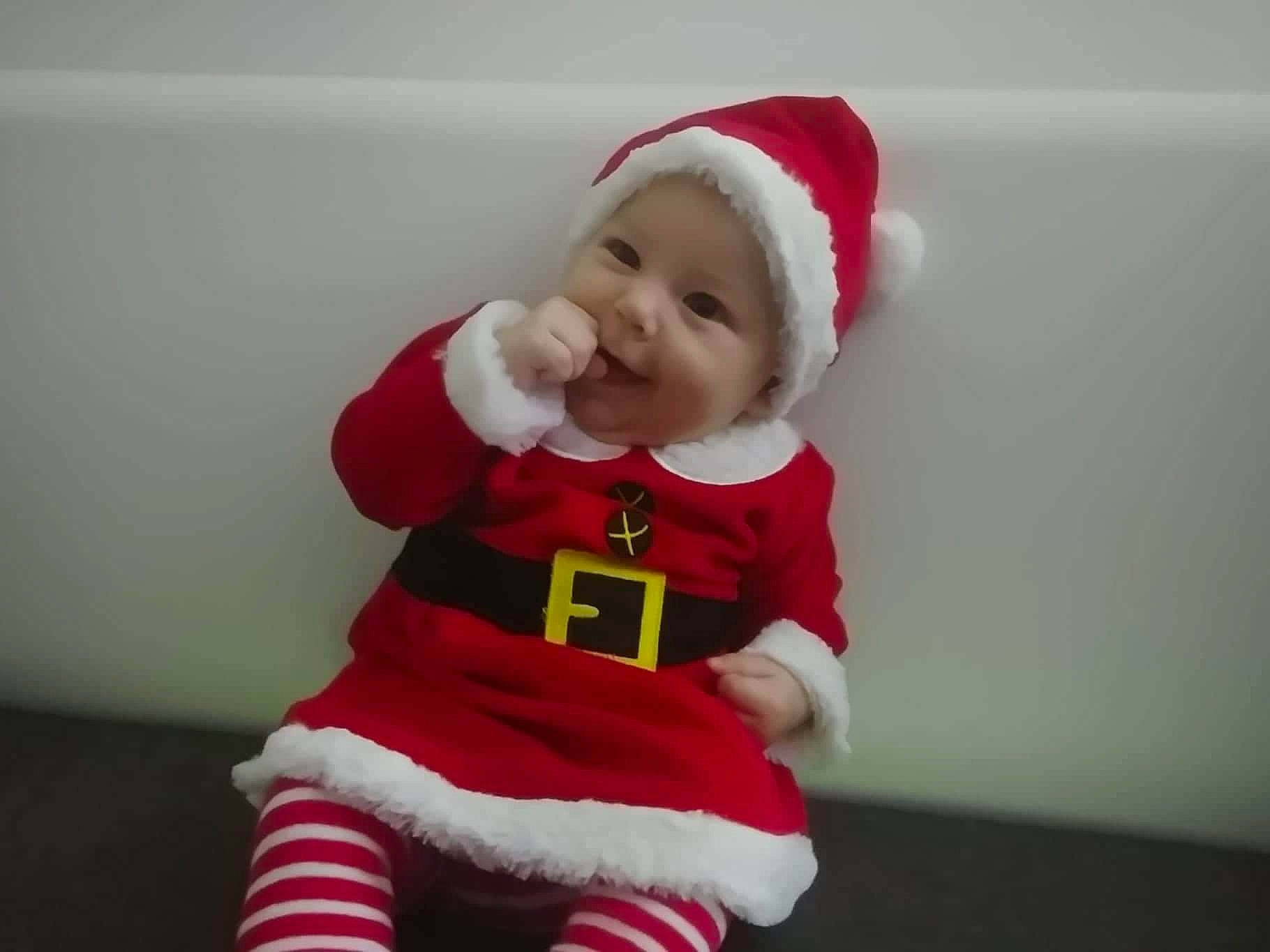 Lili joined the competition — help win amazing prizes! child, christmas, fictional_character, headwear, holiday, infant, lap, person, product, red, santa_claus, textile, toddler