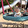 Ayden participe au concours pour gagner de l'argent avec cette photo : child, clothing, daylight, fun, hand, hoodie, metal, nature, outdoor, park, person, playground, recreation, rope, sand, slide, smiling, swing, toddler, wood