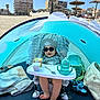 baby, bag, beach, child, footwear, highchair, outdoor, playful, relaxation, sand, shade, sippy_cup, snack, summer, sunglasses, sunhat, sunny, tent, towel, vacation