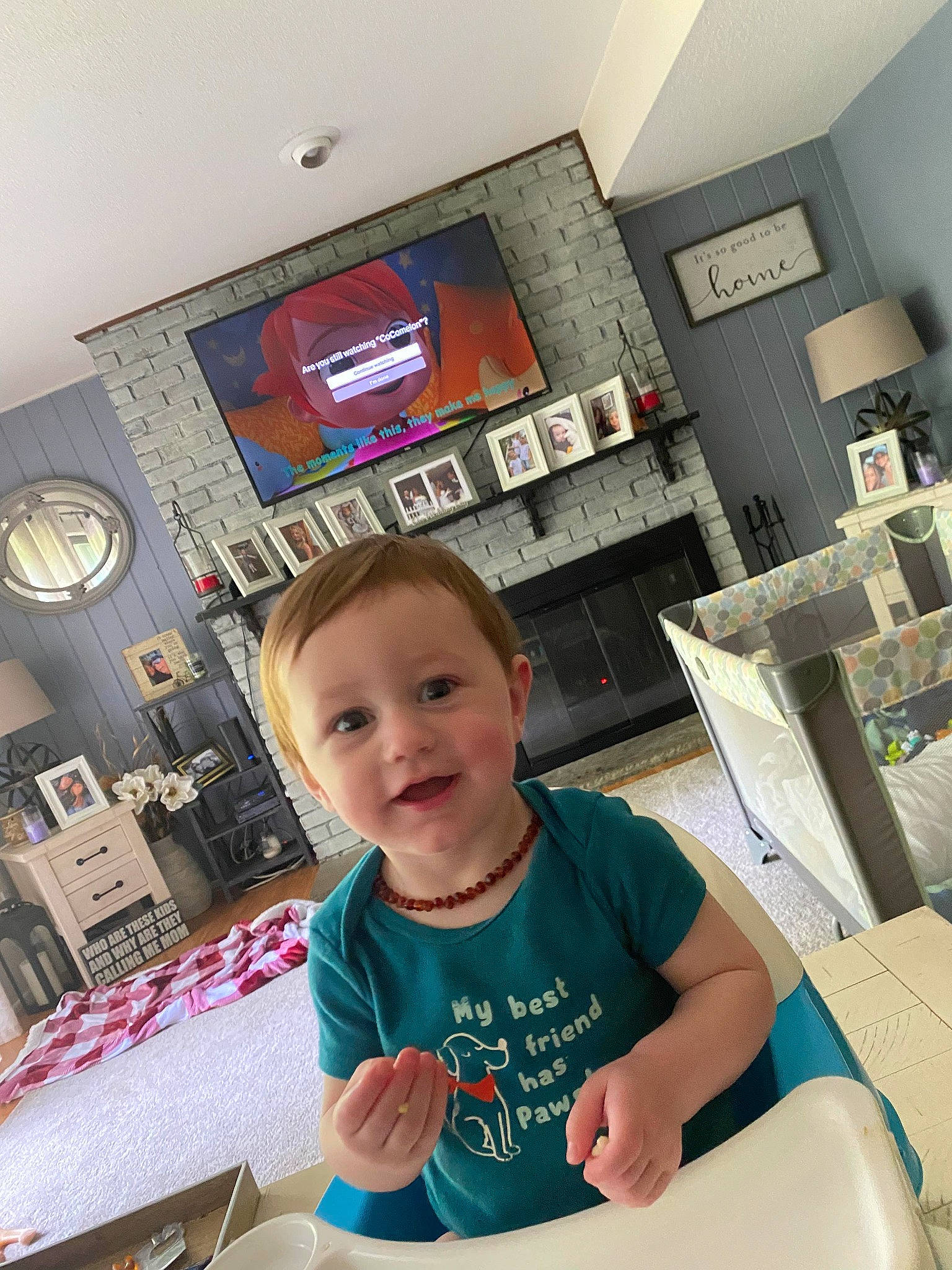 Hudson is registered to the contest to win money with this photo: baby, ceiling, chair, child, flooring, fun, happy, home_appliance, joy, kitchen, person, refrigerator, room, service, shelf, shelving, sitting, sleeve, smile, t_shirt
