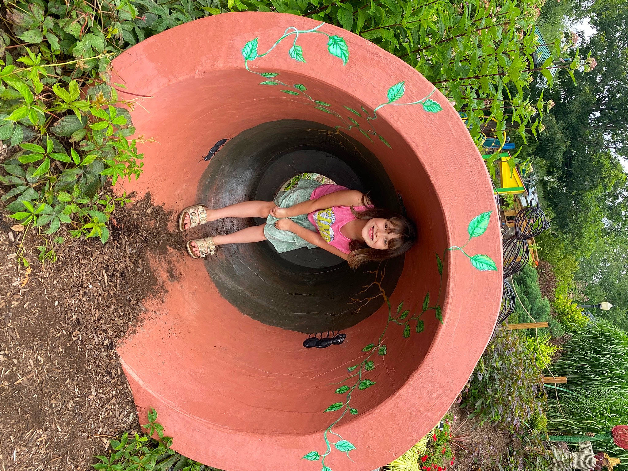 Paisley is registered to the contest to win money with this photo: auto_part, automotive_tire, automotive_wheel_system, circle, fun, garden, grass, hat, joy, landscape, leisure, person, plant, soil, synthetic_rubber, terrestrial_plant, tire, tire_care, tread, tree