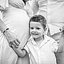 child, boy, family, pregnant, mother, father, holding_hands, smiling, black_and_white, portrait, outdoor, clothing, shirt, dress, ring, love, togetherness, happy, people, bond