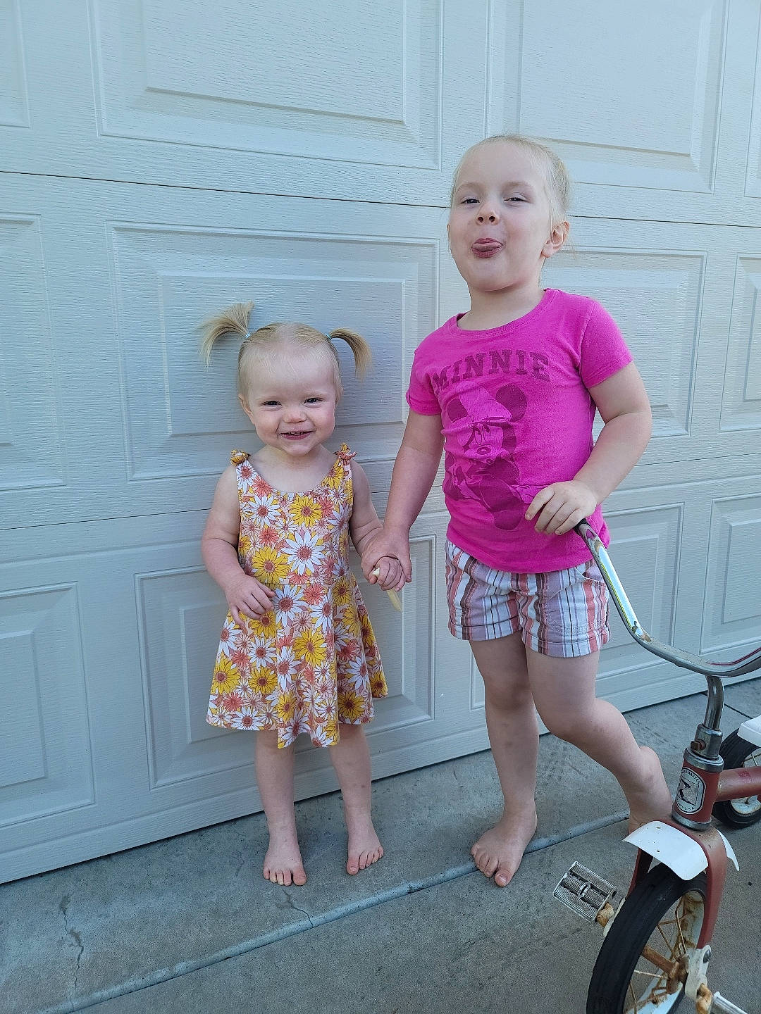 Lillianne is registered to the contest to win money with this photo: baby_toddler_clothing, beauty, door, dress, fashion, fun, hairstyle, happy, joy, magenta, person, pink, product, shorts, sleeve, smile, standing, summer, t_shirt, tire