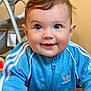 baby, child, blue_jacket, adidas, smiling, crawling, indoor, face, eyes, hair, zipper, baby_swing, floor, cute, happy, person, clothing, infant, portrait, young