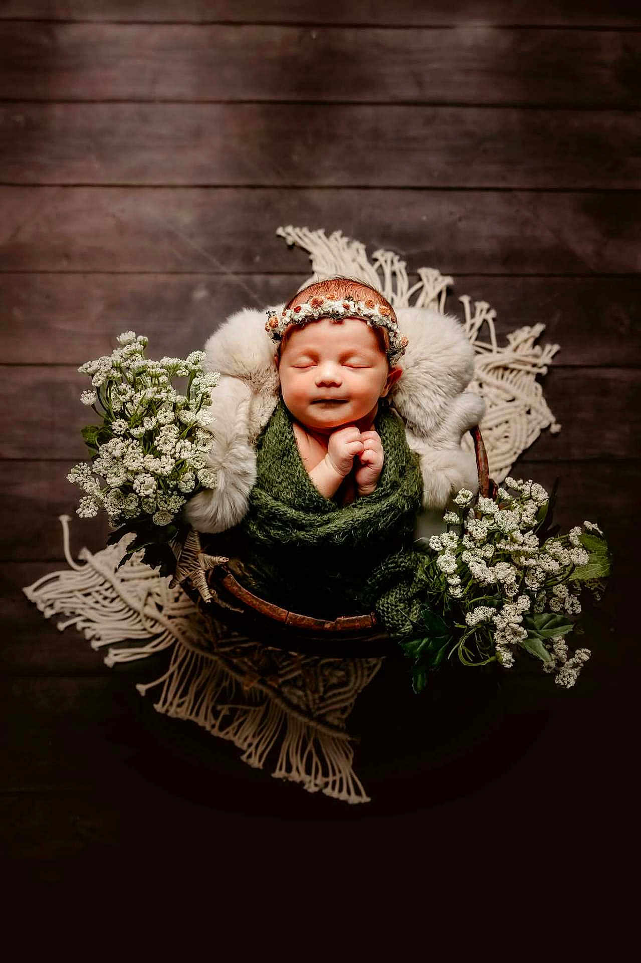 Astraea joined the competition — help win amazing prizes! newborn, baby, sleeping, flower_crown, basket, green_blanket, white_flowers, wooden_floor, cozy, portrait, infant, soft_texture, decor, peaceful, wrapped, headband, cute, resting, indoor, photography