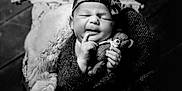 Astraea is registered to the contest to win money with this photo: newborn, baby, black_and_white, portrait, teddy_bear, headband, blanket, cozy, sleeping, cute, infant, soft_lighting, wooden_floor, wrapped, peaceful, child, indoors, small, hands, face