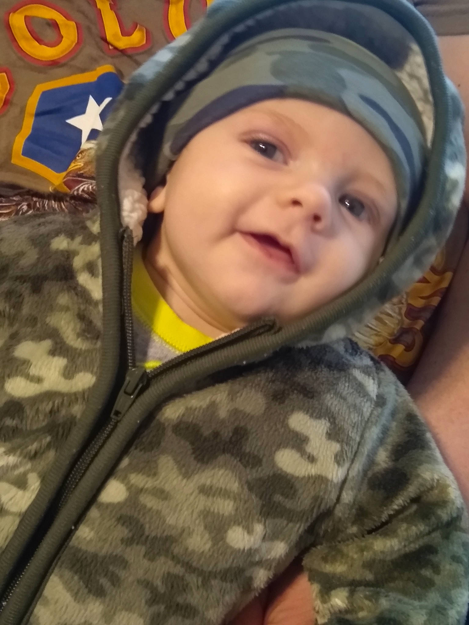 Colton is registered to the contest to win money with this photo: baby, baby_laughing, cap, cheek, child, chin, eye, eyebrow, face, fun, happy, head, headgear, headwear, iris, nose, outerwear, person, skin, sleeve
