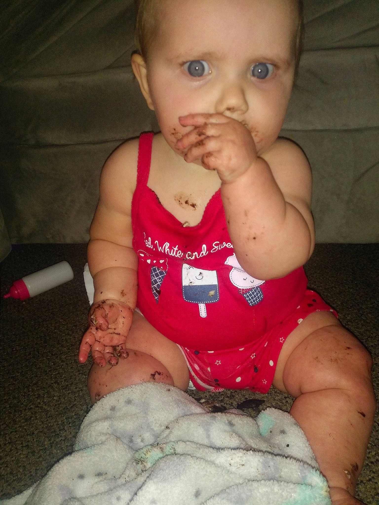 Raelynn is registered to the contest to win money with this photo: abdomen, baby, cheek, child, eye, face, finger, hand, head, lip, mouth, muscle, nose, person, pink, sitting, skin, thumb, toddler