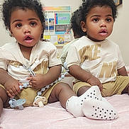 Kyrie Kairo joined the competition — help win amazing prizes! toddler, child, mirror, pacifier, clothing, sitting, indoor, cute, baby, reflection, person, sock, expression, hair, face, toy, room, furniture, shirt, footwear