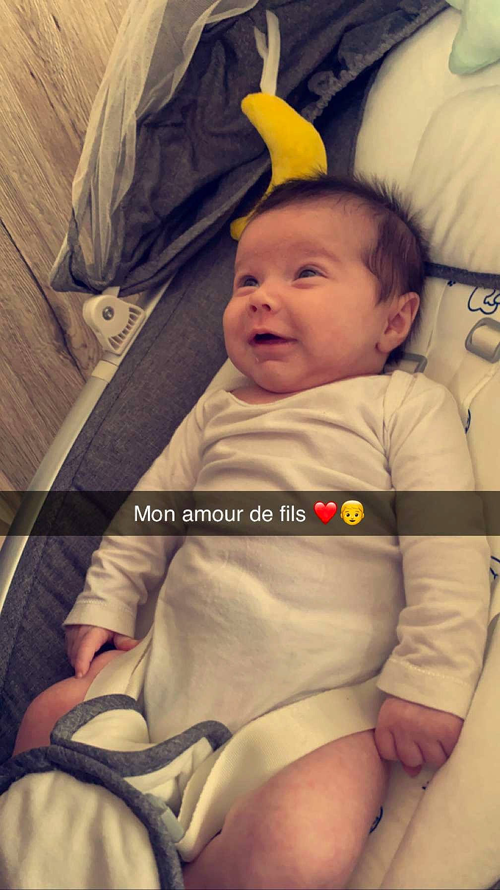 Naël participe au concours pour gagner de l'argent avec cette photo : arm, baby, baby_carriage, baby_toddler_clothing, cheek, child, comfort, cool, face, facial_expression, finger, hand, human, human_body, mouth, person, product, skin, sleeve, smile