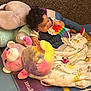 Michael Neil Adames joined the competition — help win amazing prizes! baby, child, curly_hair, plush_toy, stuffed_animal, blanket, pop_it_toy, colorful, play_mat, shoe, indoor, carpet, infant, chewing, casual_clothing, cute, toy, relaxed, floor, childhood