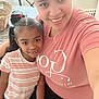 child, woman, smile, indoor, selfie, pigtails, striped_shirt, pink_shirt, happy, family, together, portrait, casual, jeans, table, chair, basket, home, person, cute