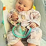 Layla-Rose is registered to the contest to win money with this photo: baby, smiling, pajamas, teething_toy, baby_seat, cushion, indoor, cute, child, infant, happy, face, hand, foot, clothing, comfort, toy, portrait, soft, young