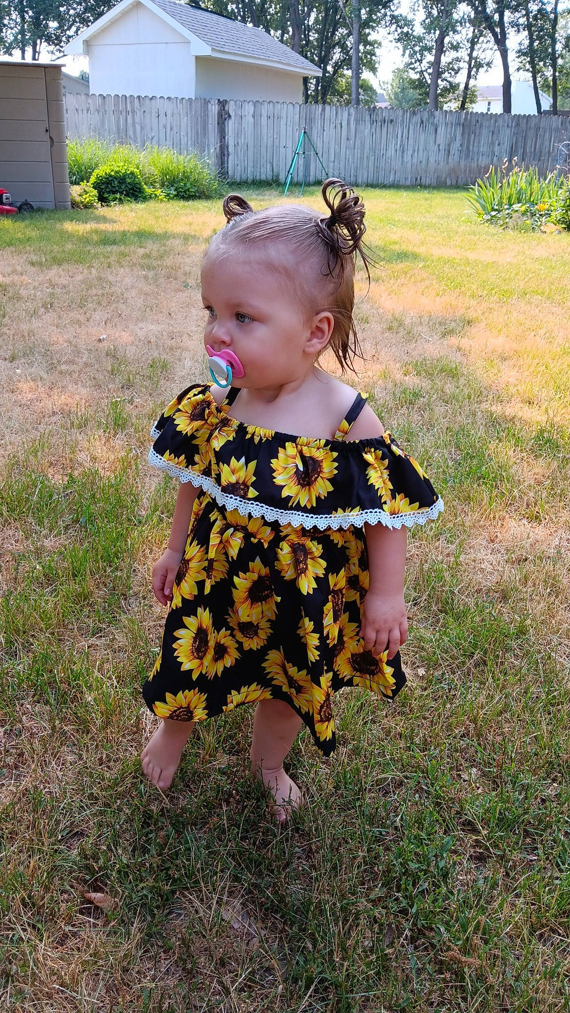 Cassandra is registered to the contest to win money with this photo: baby_toddler_clothing, child, costume, dress, fun, garden, grass, grassland, lawn, magenta, pattern, people_in_nature, person, personal_protective_equipment, plant, play, toddler, tree, yard