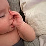 baby, blanket, child, close_up, comfort, cushion, cute, eyelashes, face, hand, indoors, infant, nap, peaceful, relaxed, rest, skin, sleeping, soft_texture, thumb_sucking