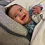 baby, smiling, blanket, cushion, bed, crib, clothing, happy, face, infant, indoors, person, sleepwear, cute, child, comfort, resting, portrait, young, cozy