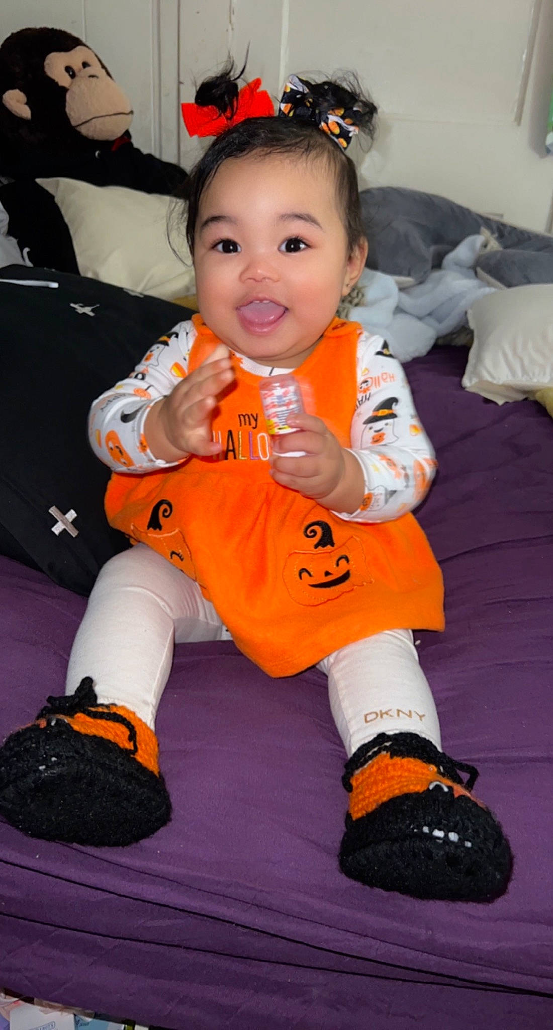 Milan Miyu is registered to the contest to win money with this photo: baby, baby_toddler_clothing, boot, chair, child, costume, face, flooring, fun, happy, head, joy, orange, person, pink, sitting, sleeve, smile, sneakers, sock