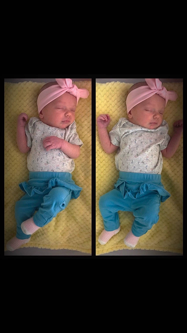 Cyrin is registered to the contest to win money with this photo: arm, baby, baby_products, baby_toddler_clothing, cap, cheek, child, comfort, facial_expression, hand, happy, headwear, magenta, pattern, person, pink, product, sitting, skin, sleeve