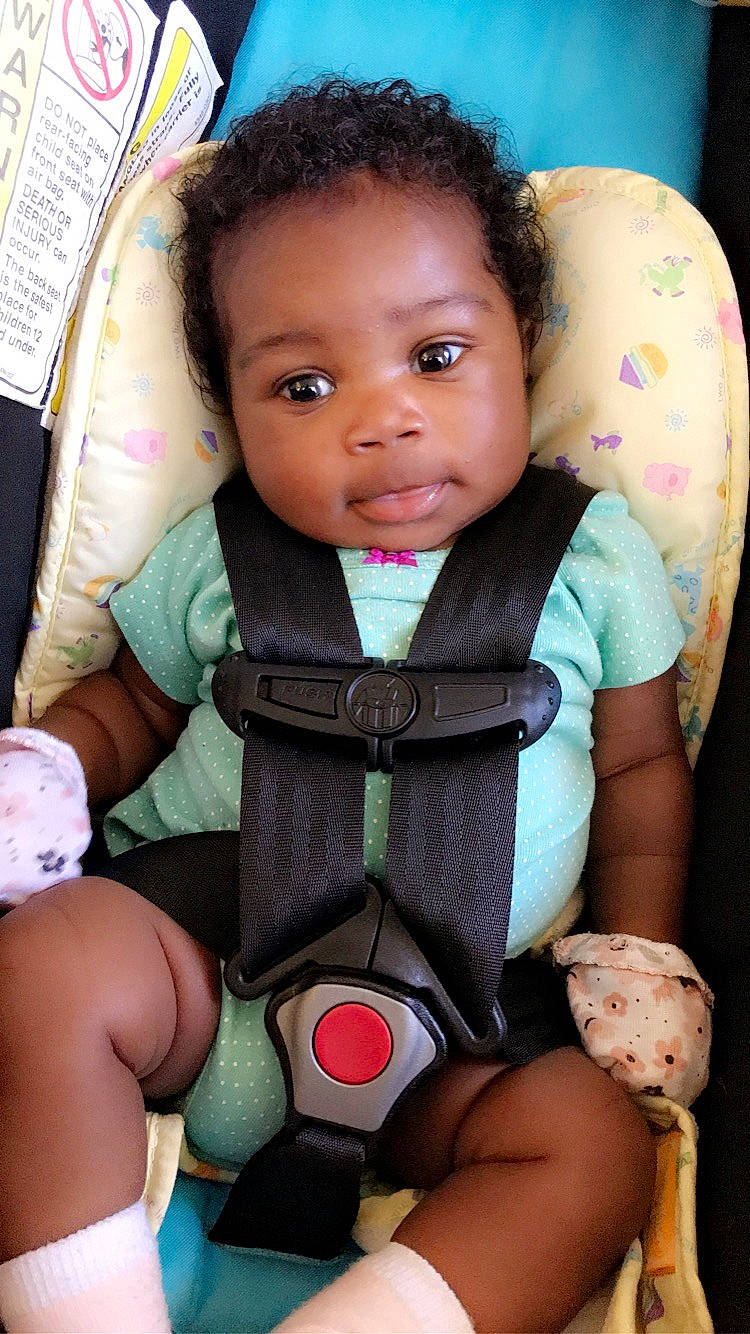 Dieore is registered to the contest to win money with this photo: baby, baby_carriage, baby_in_car_seat, baby_products, black_hair, car_seat, cheek, child, neck, person, product, sitting, skin, smile, toddler