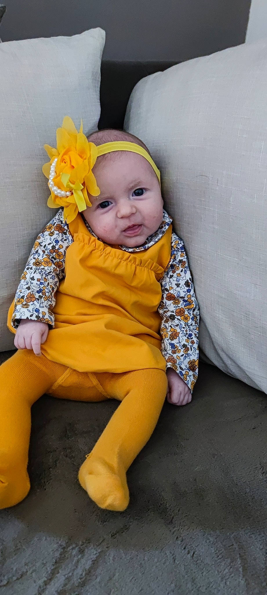 Iliana a rejoint le concours — aidez-le/la à gagner de superbes lots ! baby, baby_products, baby_toddler_clothing, cheek, child, comfort, costume_hat, dress, eye, happy, headgear, headwear, human_body, human_leg, iris, person, sitting, sleeve, smile, t_shirt