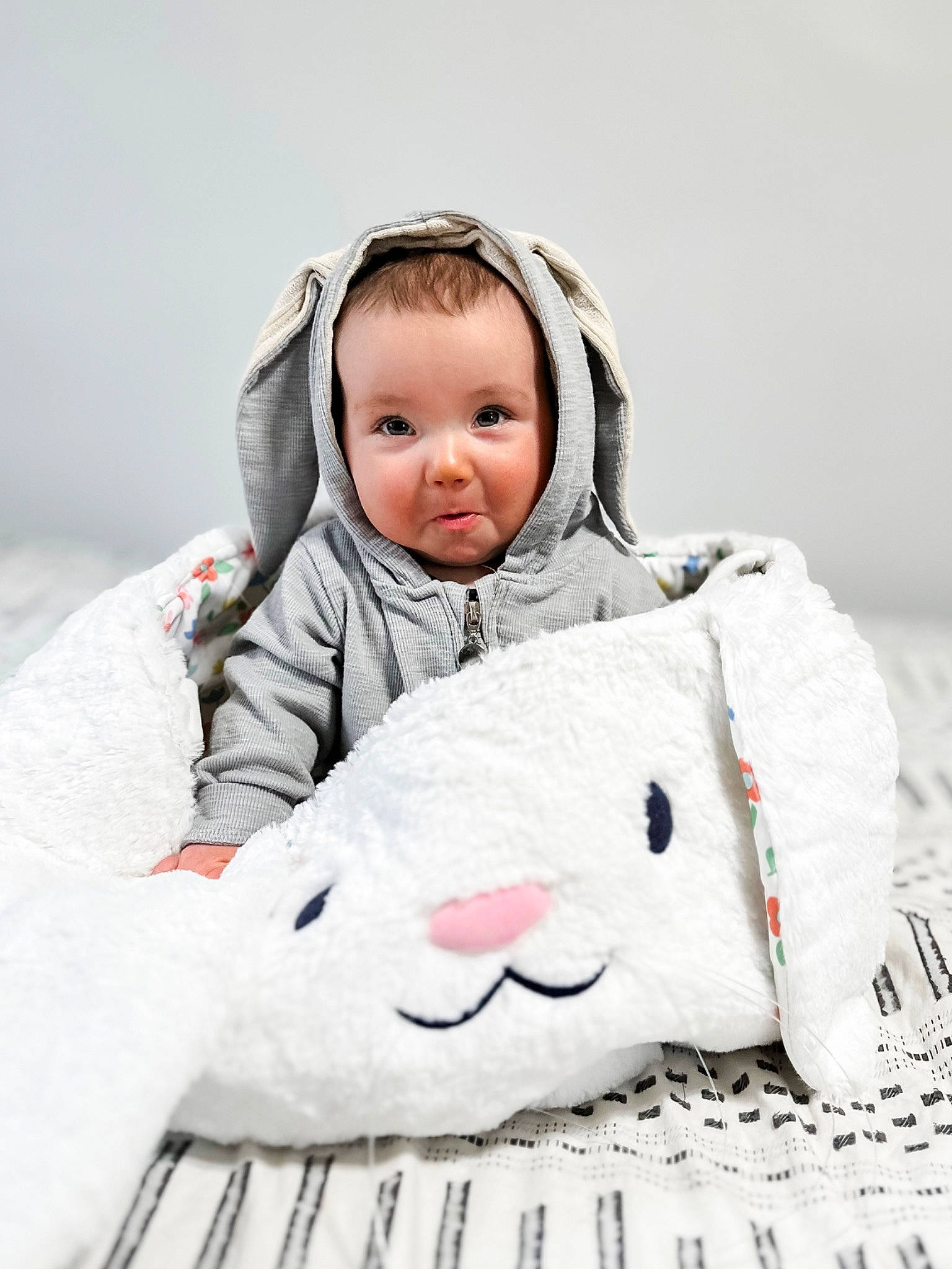 Harrison joined the competition — help win amazing prizes! baby, baby_products, baby_toddler_clothing, cheek, child, comfort, fun, fur, happy, linens, mammal, outerwear, person, plush, sitting, skin, sleeve, smile, stuffed_toy, toddler