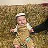 baby, child, infant, hay, overalls, cap, socks, pacifier, smiling, sitting, hand, corduroy, indoor, cute, support, person, face, expression, comfort, rustic