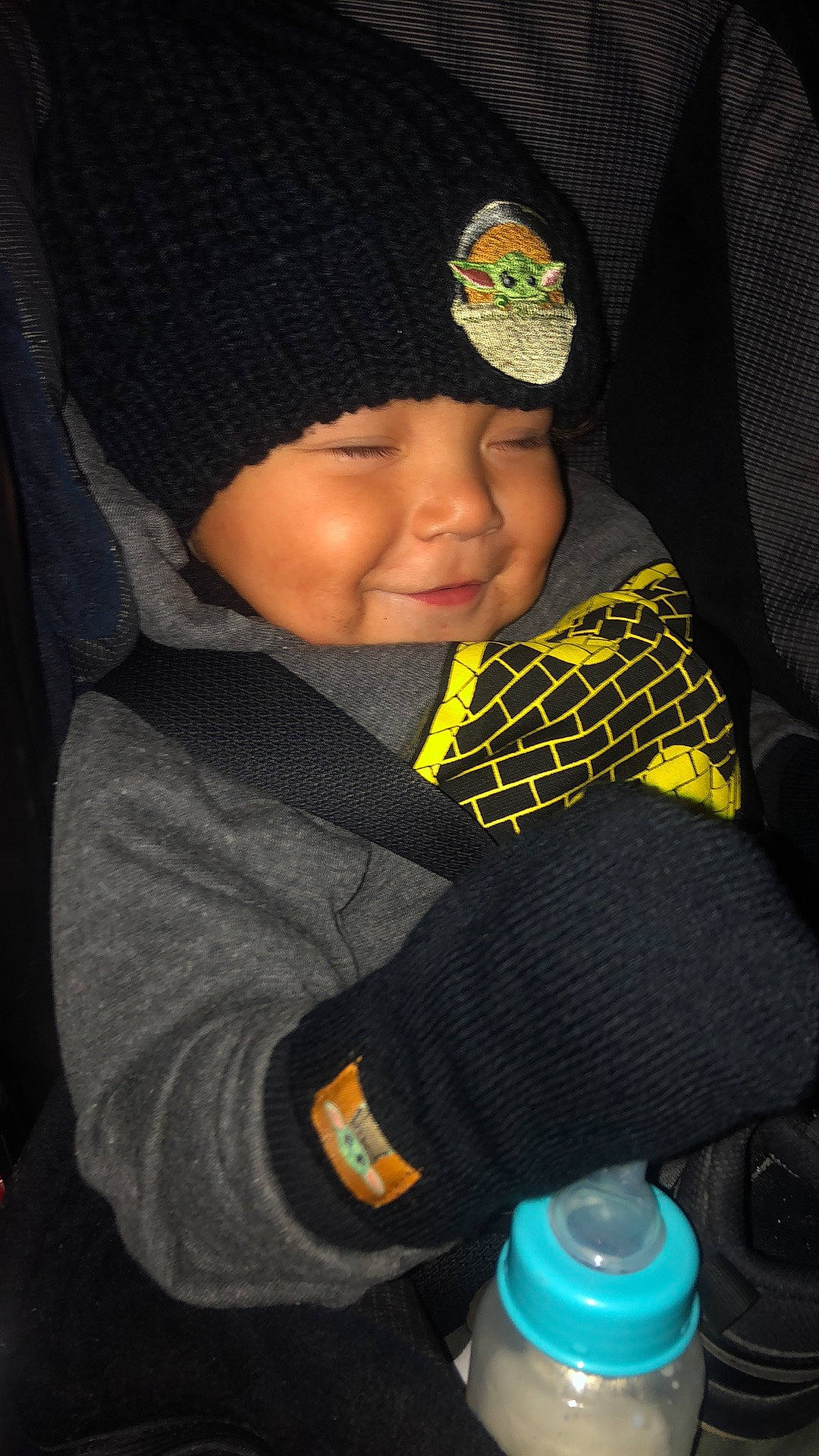 Ayden is registered to the contest to win money with this photo: beanie, bonnet, glove, headwear, hood, joy, knit_cap, knitting, person, plastic, plastic_bottle, safety_glove, water_bottle, winter, wool, woolen