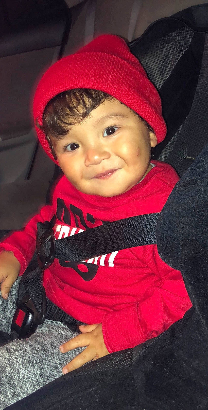 Ayden is registered to the contest to win money with this photo: baby, baby_products, baby_toddler_clothing, beanie, bonnet, car_seat, carmine, cheek, child, comfort, cool, headgear, headwear, hood, joy, lip, person, portrait_photography, product, red