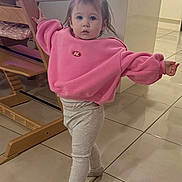 Bonnie joined the competition — help win amazing prizes! toddler, child, pink_sweatshirt, silver_shoes, standing, high_chair, wooden_furniture, tile_floor, indoor, pose, little_girl, long_sleeves, pants, hair_tied, cute, expression, person, home, floor, young_child