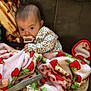 Karmyn joined the competition — help win amazing prizes! baby, blanket, pacifier, couch, hand, smartphone, infant, cozy, strawberry_pattern, clothing, portrait, indoors, child, cute, relaxing, seated, warm, soft, curious, comfort
