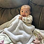 baby, blanket, couch, pacifier, infant, soft, cozy, child, face, smile, clothing, furniture, indoor, portrait, sitting, cute, young, comfort, relax, home