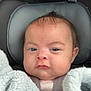 Karmyn joined the competition — help win amazing prizes! baby, infant, car_seat, blanket, child, face, head, hair, mohawk, clothing, seat_belt, sitting, closeup, indoors, expression, cute, soft_texture, warm, portrait, young_child