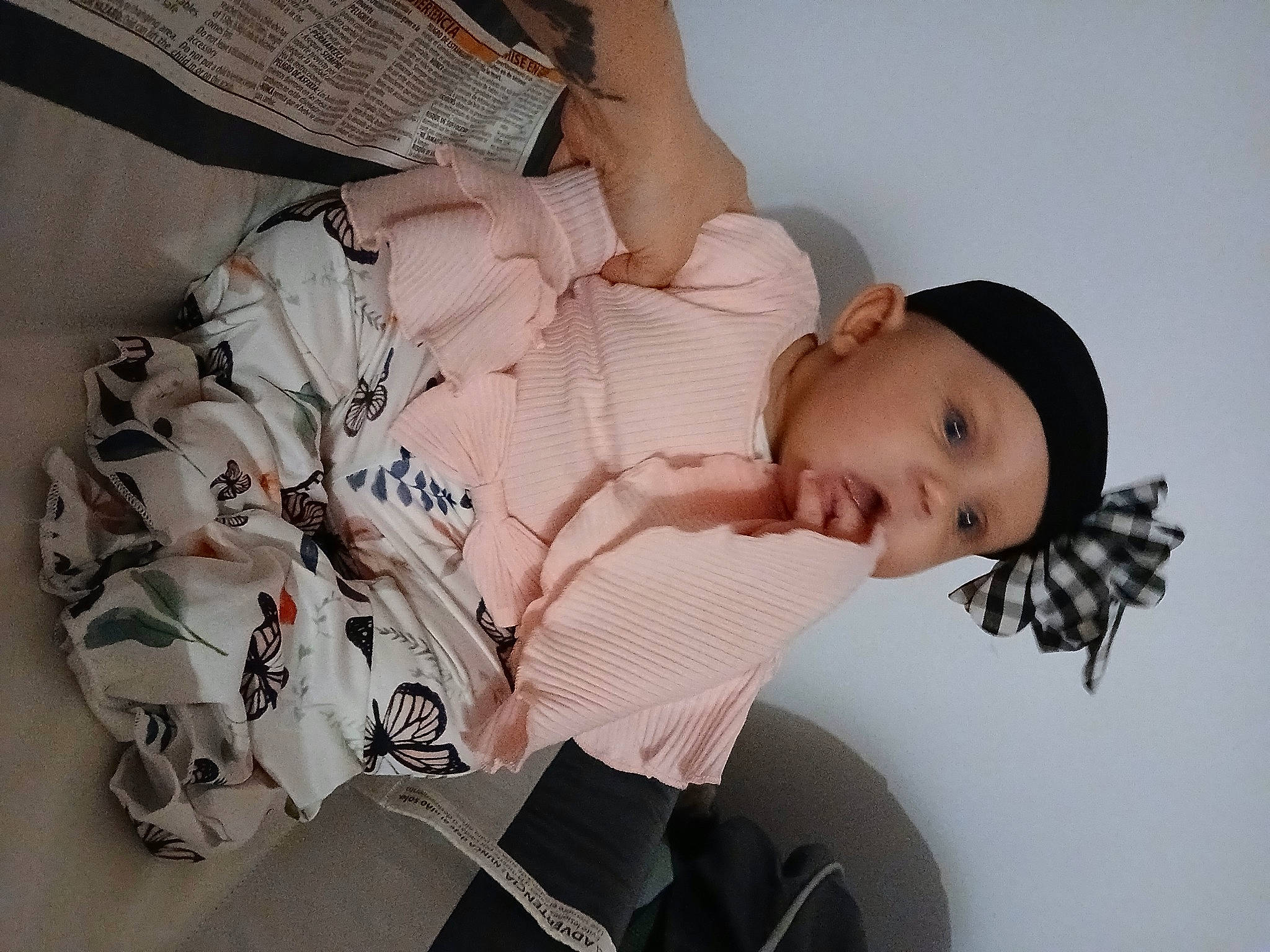 Lilianne is registered to the contest to win money with this photo: arm, baby, baby_products, baby_toddler_clothing, child, comfort, dress, elbow, finger, flash_photography, hand, headwear, human_body, human_leg, leg, pattern, person, sitting, sleeve, textile