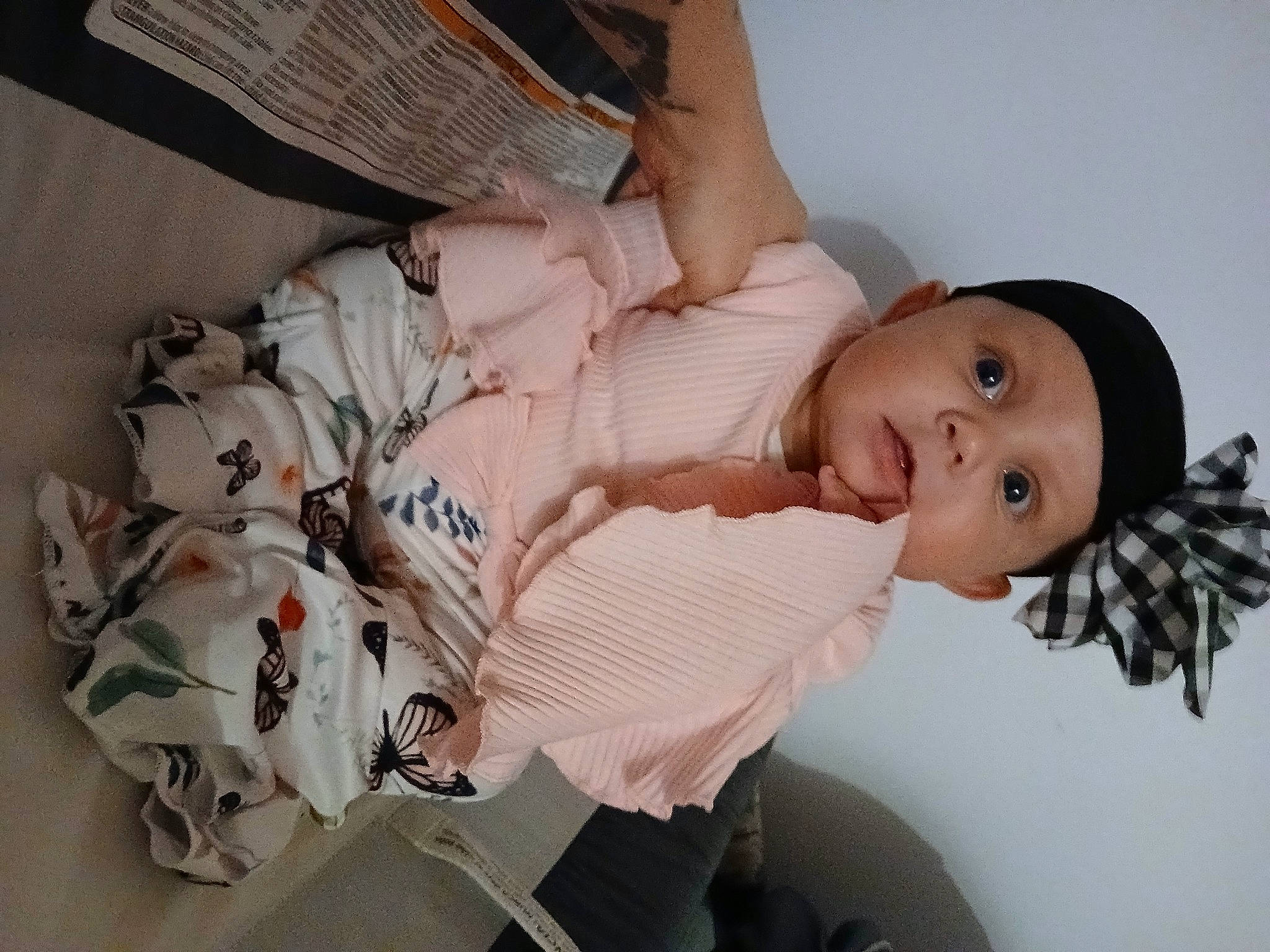 Lilianne is registered to the contest to win money with this photo: abdomen, baby, baby_products, chest, child, comfort, dress, elbow, eyelash, fun, happy, headwear, human_leg, nail, pattern, person, room, sitting, skin, thigh